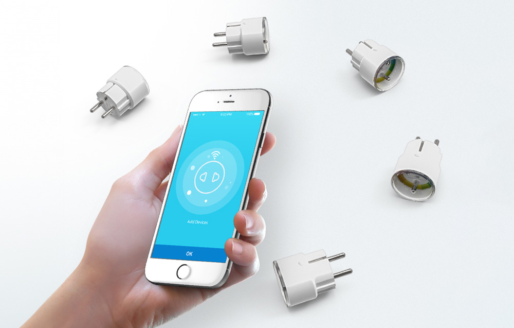 NEO NAS-WR07W Wi-Fi Smart Sockets spread out on a white surface in a circle. In the foreground, a hand holding a smartphone. The app is visible on the screen.